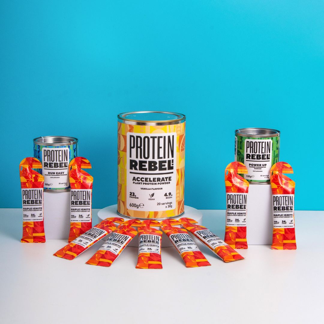Protein Rebel products including a can, packets, and bars on a blue background
