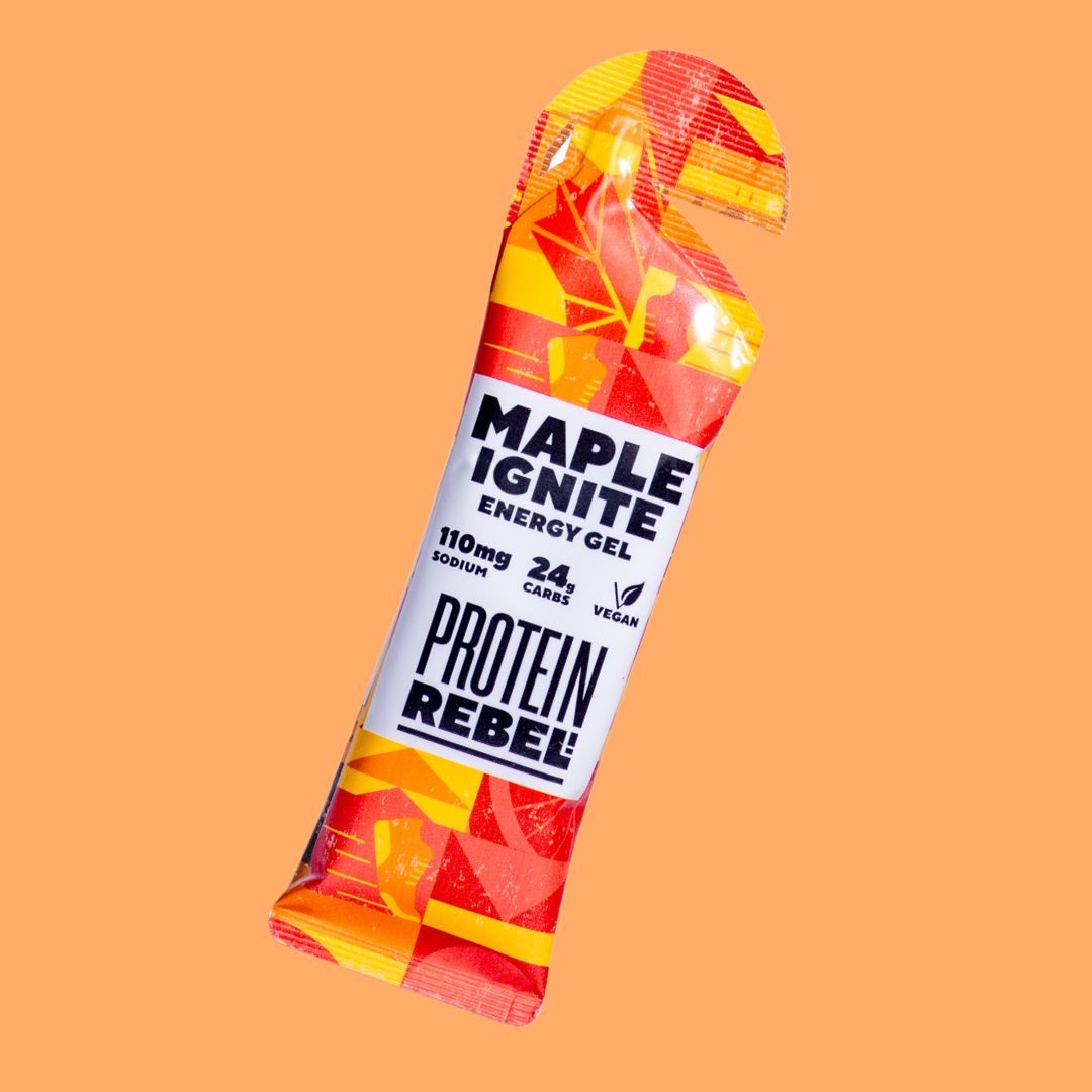 Protein Rebel energy gel packaging on an orange background