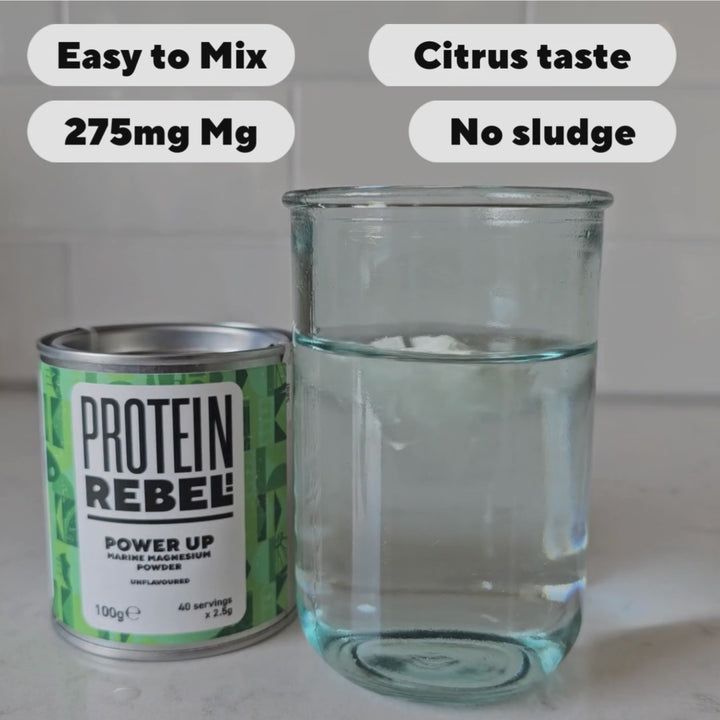 Power Up magnesium powder is shown mixing in a glass of water